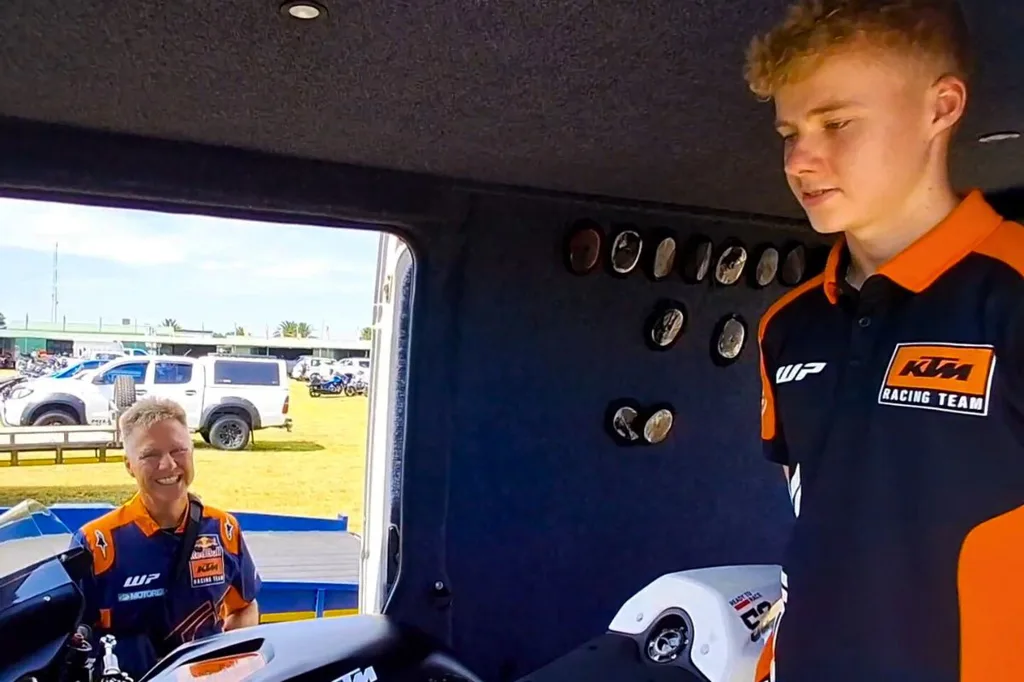 Red Star_Amid Motorcycle Expo 2026 - A very Proud Thomas watches on with a huge grin as young Troy tells us of his plans to try out for the Spanish Championship this year