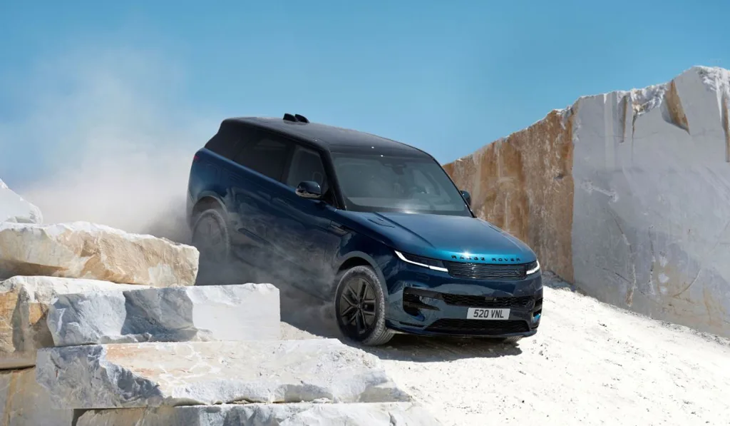 3. Range Rover Sport Electric - All-Wheel Steering make the large SUV feel smaller and more responsive - blue variant down hill off road quarry